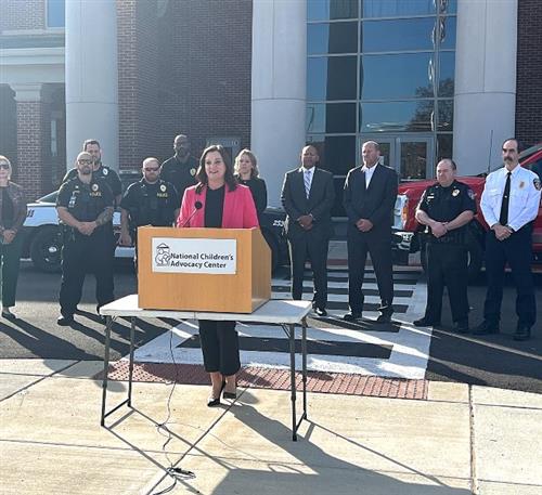  Stephanie Allen with officials in background in front of Journey Middle School